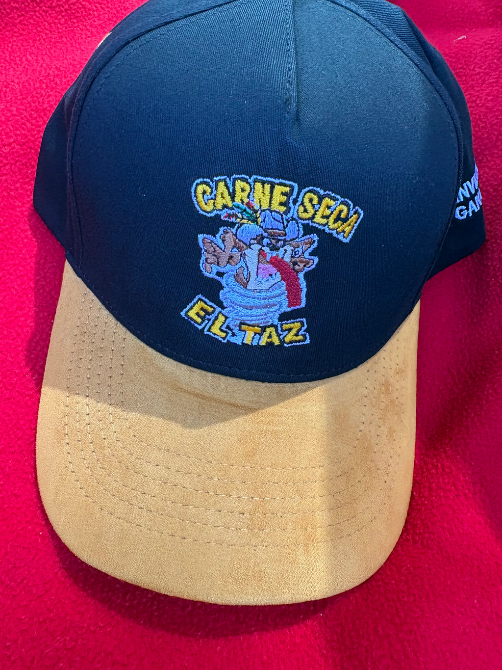 Black hat with yellow suede